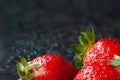 Strawberry. Juicy ripe strawberries with drops of water on a wet dark background. Red berries. Copy space. Close-up. Selective Royalty Free Stock Photo