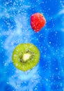 Strawberry and kiwi fruit in a water splash Royalty Free Stock Photo