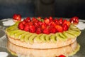 Strawberry and kiwi pie, Fruit cake with vanilla cream, white flower sugar decoration Royalty Free Stock Photo