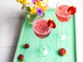 Strawberry lemonade on a tray, picnic concert.