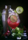 Strawberry lime iced lemonade, non alcoholic cocktail, black table with bar tools, selective focus