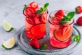 Strawberry lime mojito with fresh mint and ice in glass jar Royalty Free Stock Photo