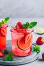 Strawberry lime mojito with fresh mint and ice in glass jar Royalty Free Stock Photo