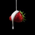 Strawberry Making A Splash. Isolated on black background. Royalty Free Stock Photo