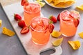 Strawberry margarita cocktail with lime and crushed ice Royalty Free Stock Photo