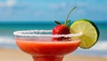 strawberry margarita and Daiquiri frozen and on ice with lime and berry fruit at beach side for summer time relaxation in the sun Royalty Free Stock Photo
