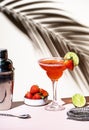 Strawberry Margarita summer cocktail drink with silver tequila, lime juice, liqueur, fresh berries and ice in glass with salt rim Royalty Free Stock Photo