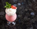 Strawberry milkshake on a dark marble table Royalty Free Stock Photo