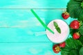 Strawberry-milkshake in a glass on a bright background