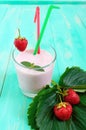 Strawberry-milkshake in a glass on a bright background Dietary menu.