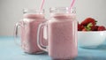 Strawberry milkshake in mason jars Royalty Free Stock Photo