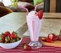Strawberry milkshake with strawberry syrup decorated with fruit