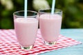 Strawberry milkshake on wooden background Royalty Free Stock Photo