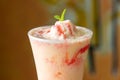 strawberry With Mint and cream Juice served in disposable glass isolated on table top view of arabian food