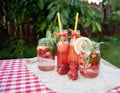 Strawberry and mint infused detox water. strawberry lemonade with ice and mint as summer refreshing drink in jars. Cold soft Royalty Free Stock Photo