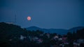Strawberry Moon over Brasov city