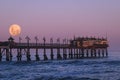 Strawberry Moonset over the Swakopmund Jetty