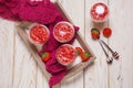 Strawberry mousse pudding or panna cota in glass on white wooden table