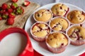 Strawberry muffins on white plate with cup of milk and fresh berries Royalty Free Stock Photo