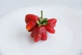 Strawberry Mutant. Red strawberry in the form of a heart on a white background