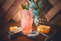 Strawberry orange alcoholic cocktail with lime and orange, served as refreshment drink in local pub Royalty Free Stock Photo