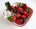 Strawberry With orchid on White Plate With Orchids Royalty Free Stock Photo