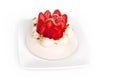 Strawberry Pavlova cake on white plate on a white background isolated close up Royalty Free Stock Photo