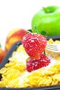 Strawberry,peach,apple,kiwi, fork, milk and flakes Royalty Free Stock Photo