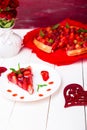 Strawberry pie on white plate and white wooden table. One piece. Romantic. Love. Heart. Royalty Free Stock Photo