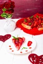 Strawberry pie on white plate and white wooden table. One piece. Romantic. Love. Heart. Royalty Free Stock Photo