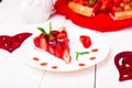 Strawberry pie on white plate and white wooden table. One piece. Romantic. Love. Heart. Royalty Free Stock Photo