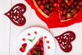 Strawberry pie on white plate and white wooden table. One piece. Top view. Romantic. Love. Heart. Royalty Free Stock Photo