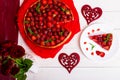 Strawberry pie on white plate and white wooden table. One piece. Top view. Romantic. Love. Heart. Royalty Free Stock Photo