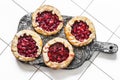 Strawberry pie on a wooden rustic board on a light background Royalty Free Stock Photo