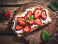 strawberry pieces on a piece of bread spread with cream cheese