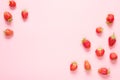 Strawberry on pink background. Flat lay, top view. Copy space.