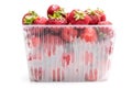 strawberry in plastic transparent container box, isolated on white background Royalty Free Stock Photo