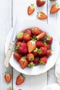 Strawberry plate with knife top view Royalty Free Stock Photo