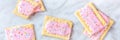 Strawberry pop tarts panorama. Many toaster pastries, an overhead flat lay shot Royalty Free Stock Photo