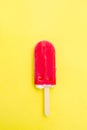 Strawberry popsicle on yellow Royalty Free Stock Photo