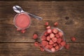 Fresh made Strawberry powder on a rustic background