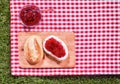 Strawberry preserve with a fresh crusty roll Royalty Free Stock Photo