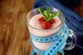 Strawberry protein cocktail in an Irish mug wrapped into a blue measure tape Royalty Free Stock Photo