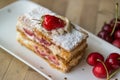 Strawberry puff mille-feuille with cherry Royalty Free Stock Photo