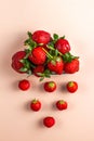 Strawberry rain. A plate in the form of a cloud with strawberries on a pink background. flat lay Royalty Free Stock Photo