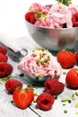 Strawberry and raspberry ice cream scoop with chopped nuts and w Royalty Free Stock Photo