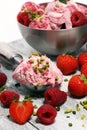 Strawberry and raspberry ice cream scoop with chopped nuts and w Royalty Free Stock Photo