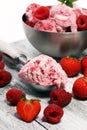 Strawberry and raspberry ice cream scoop with chopped nuts and w Royalty Free Stock Photo