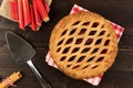 Strawberry and rhubarb pie on dark wood background Royalty Free Stock Photo