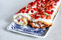 2 strawberry roulade cakes on decorative plate Royalty Free Stock Photo